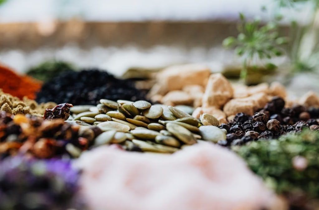 Close-up of assorted spices and seeds showcasing culinary diversity.